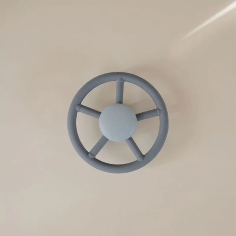 Jouet à ventouse Mushie - volant bleu - Babynouch